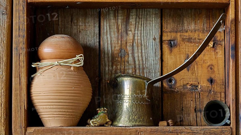 Clay pot and brass jug on an old wooden rack, Meronas village, Meronas, Amari Basin, Central Crete, Greek Islands, Greece