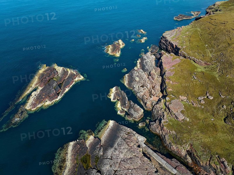 Aerial photo of the red cliffs at Rua Reidh Point, Gairloch, Scotland, UK