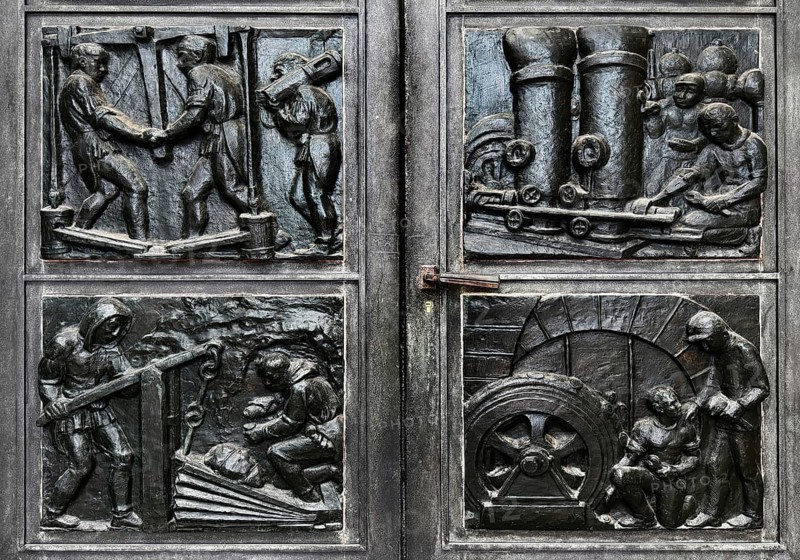 Depictions from the everyday life of miners in bronze reliefs by Otto Bussmann and Maria Schlüter at the door portal, Deutsches Bergbau Museum, Bochum, Germany
