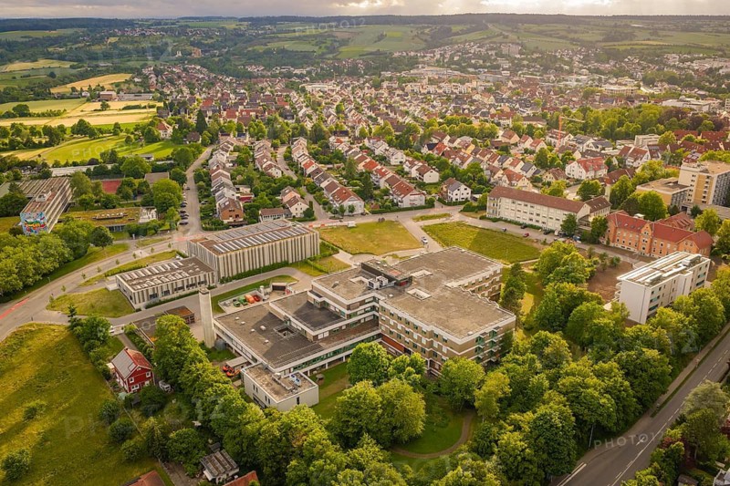Urban landscape with a large central building surrounded by residential buildings and nature, new IGZ, The Integrated Health Center Herrenberg, former Herrenberg Hospital, Böblingen district, Germany