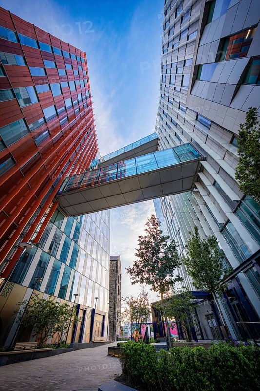 Two modern Google buildings with a glass connection and a bridge over it, urban ambiance, Docklands Dublin, Ireland