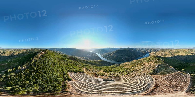 360 degree sunrise panorama of the Douro River winding through terraced vineyards and hills in Portugal's Douro Valley wine region