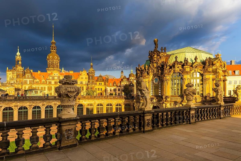Glockenspiel pavilion of the Zwinger and Residenzschloss in the evening light in front of a dark rainy sky, Dresden, Saxony, Germany