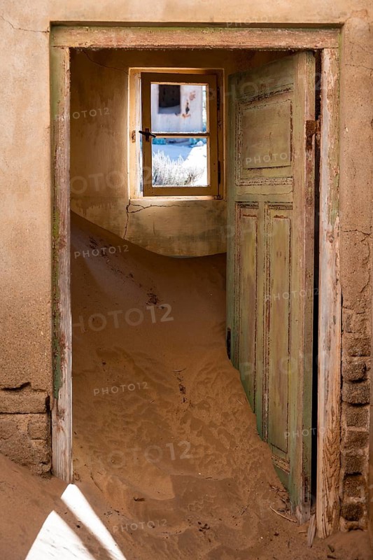 Interior view, doors and house full of sand, former diamond mining town, Namib Desert, Kolmanskop, Karas, Namibia