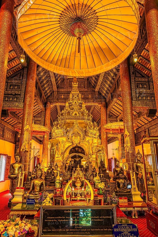 Sumptuous interior with richly decorated wooden ornaments, gilded Buddha statues, Buddhist temple complex Wat Phra That Si Chom Thong, near Chiang Mai, Chiang Mai Province, Thailand
