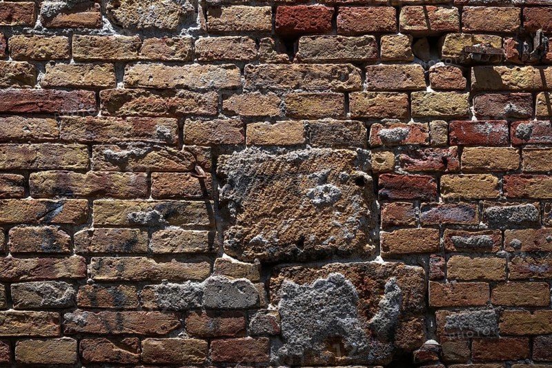 Close-up of an old brick wall with different colors and scuffs, Palermo, Sicily, Italy