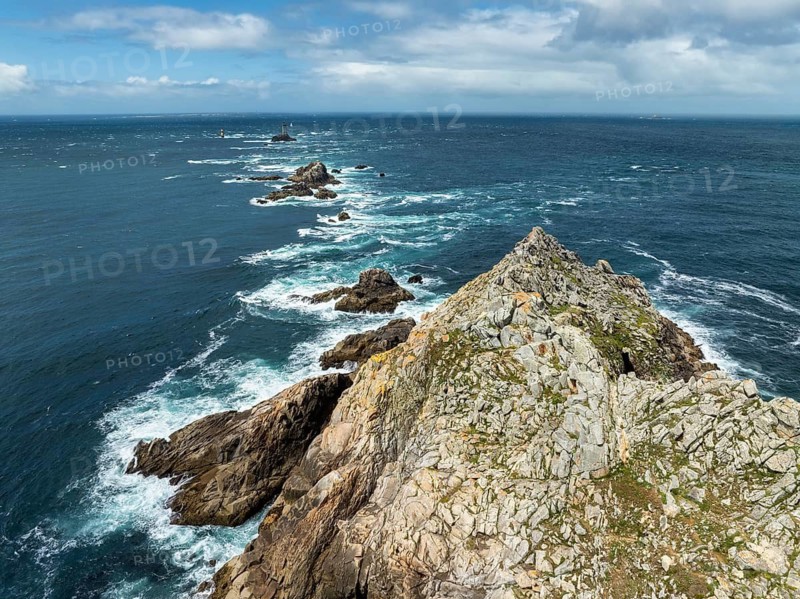 Aerial view of Pointe du Raz with the Phare de la Vieille lighthouse in front of a rocky island, Pointe du Raz, Finistère, Brittany, France