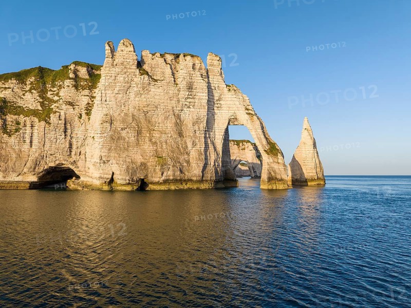 Aerial view of the Porte d'Aval rock formation shortly after sunrise, well-known landmark on the chalk coast with the distinctive Aiguille d'Étretat rock pin, behind it the La Manneporte rock gate, Étretat, Alabaster Coast, La Côte d'Albâtre, chalk cliffs, English Channel, Seine-Maritime, Normandy, France