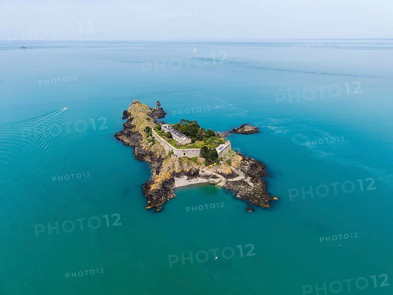 Aerial view of the historic Île des Rimains fortress island with the Fort des Rimains in the turquoise sea. The former lake-fort is located off the coast of the municipality of Cancale, Côte d'Émeraude, Emerald Coast, Ille-et-Vilaine department, Brittany, English Channel, France