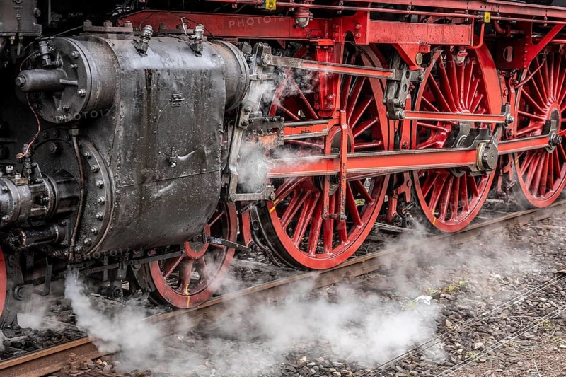 Detailed view of the drive wheels and coupling rods of a steam locomotive, Bochum railway museum, museum days weekend, with many attractions such as steam locomotive rides, 3 locomotives are under steam, historic trains make round trips through the Ruhr Valley, many locomotives can be visited, on the site of the former Dahlhausen railway depot, North Rhine-Westphalia, Germany