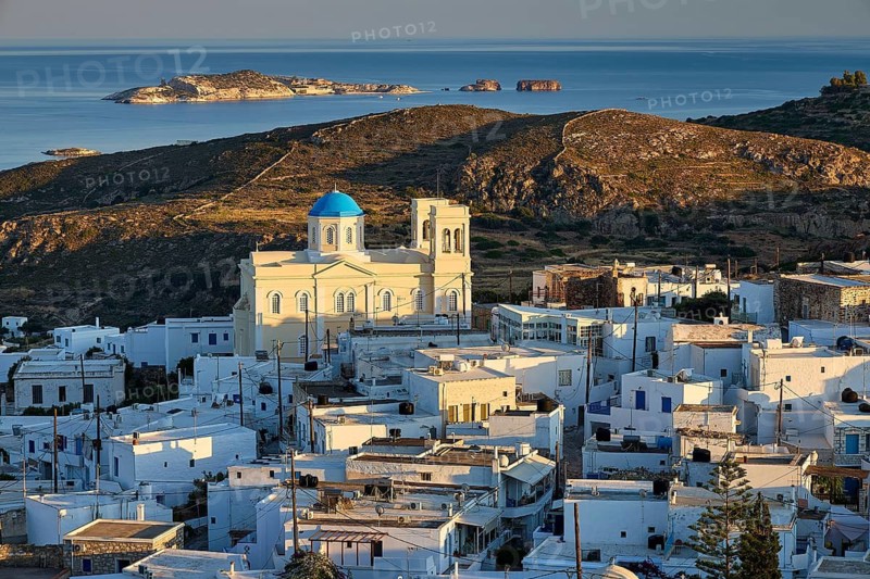 Church, Panagia Odigitria, coastal view of a white Greek village with a blue domed church over the sea, main town on Kimolos, Kimolos, Chorio, island of Kimolos, neighboring island of Milos, Cyclades, Greek islands, Greece
