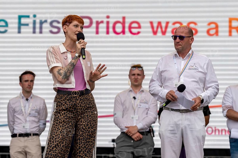 Sophie Koch, Queer Representative of the Federal Government and Member of Parliament (SPD) in the Saxon State Parliament, and Ronald Zenker, Board Spokesman and Overall Director of CSD, on a stage at Christopher Street Day in Dresden on 6 June 2026. In his opening speech, Ronald Zenker also addressed the legal dispute over the Altmarkt: the accompanying three-day street festival had only recently had to fight for its status as a political gathering in court