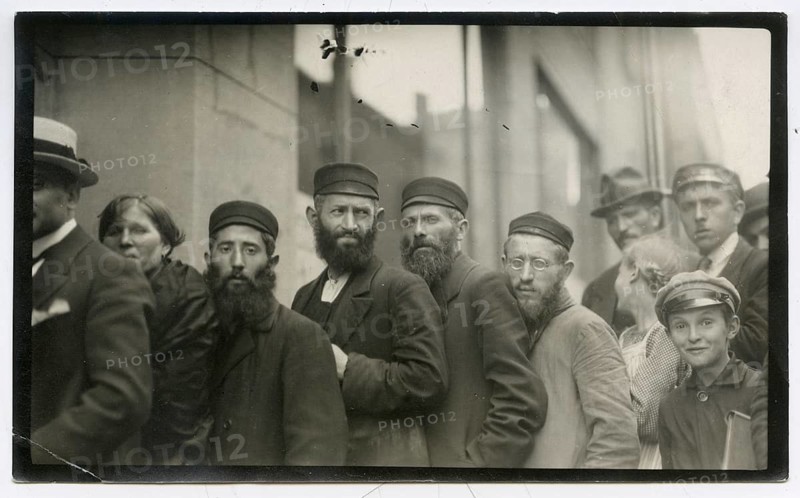Jews, men, Warsaw, Poland, US consulate, standing in line for passports and visas, groups of men with hats and beards standing in line on the street, November 1920