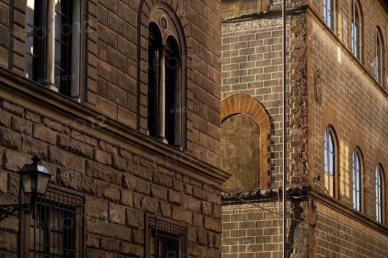 Historic buildings with detailed brick façade in warm evening light, old town, Florence, Tuscany, Italy