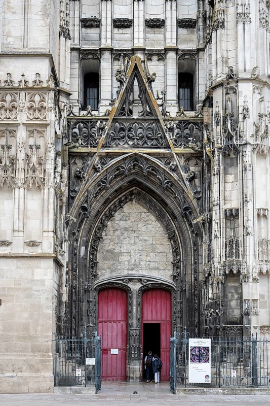 Detailed view of the magnificent main portal of the Saint-Pierre-et-Saint-Paul de Troyes cathedral in late Gothic style with richly decorated reliefs, pointed arches and a monumental church portal made of light sandstone. Troyes, Aube Department, Grand Est Region, France