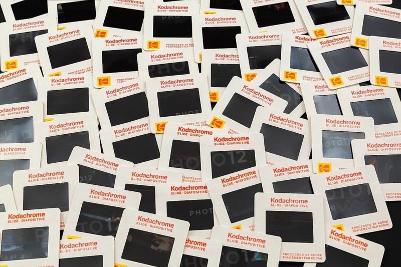 Old loosely arranged 1980s 35mm Kodak Kodachrome slides mounted in white cardboard frames with bilingual English and French wording for the Canadian market, Studio Composition, Quebec, Canada
