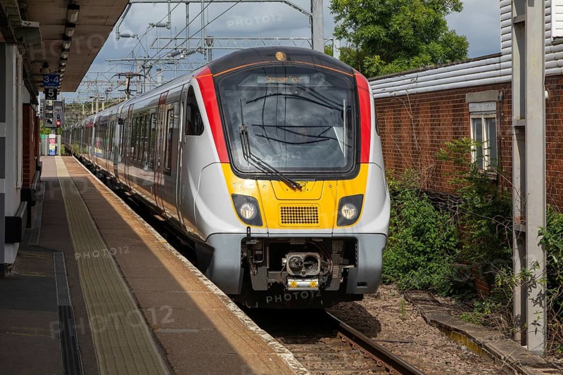 Greater Anglia Class 720 Aventra electric multiple unit locomotive train arriving at platform railway station, Colchester, Essex, England, UK