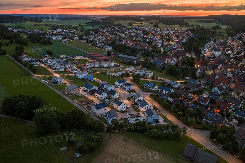 Comprehensive view of a large residential area and landscape in evening light, Gechingen, Hecken and Gäu region, Landreis Calw, Germany