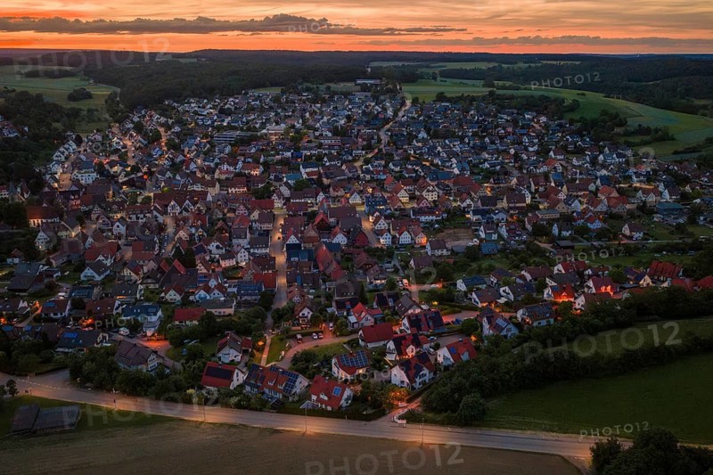 View of village at sunset, street lighting highlights architecture, Gechingen, Hecken and Gäu region, Landreis Calw, Germany