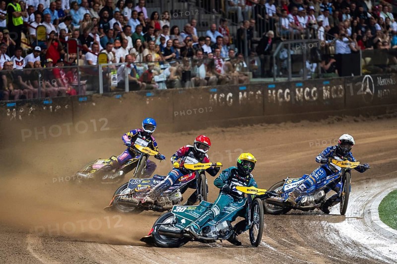 WROCLAW, POLAND - JUNE 20, 2026: DEWALT FIM Speedway GP of Poland. Speedway riders competing on dirt track. Heat 3. Leon Madsen (Y) Bartosz Zmarzlik (W) Dominik Kubera (R) Kacper Woryna (B)