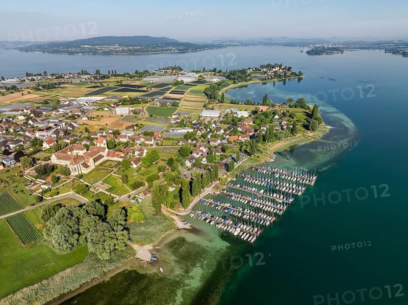 Aerial view of the island of Reichenau, in western Lake Constance, Untersee, with the marina, pleasure boat harbour Herrenbruck, on the left the cathedral of St. Maria and Markus and the monastery, former Benedictine abbey in the district of Mittelzell, on the horizon the Höri peninsula, near Radolfzell, district of Konstanz, Baden-Württemberg, Germany