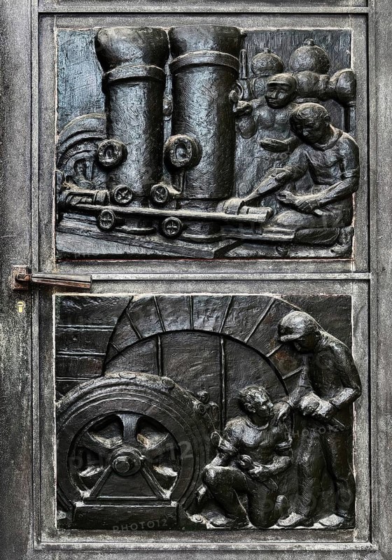 Depictions from the everyday life of miners in bronze reliefs by Otto Bussmann and Maria Schlüter at the door portal, Deutsches Bergbau Museum, Bochum, Germany