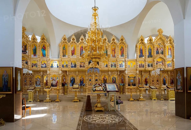 An extensive church room with richly decorated golden iconostasis and colorful religious paintings, Nicoreni monastery Sf. Ilie, Nicoreni, Drochia, Bessarabia, Republic of Moldova, Moldova
