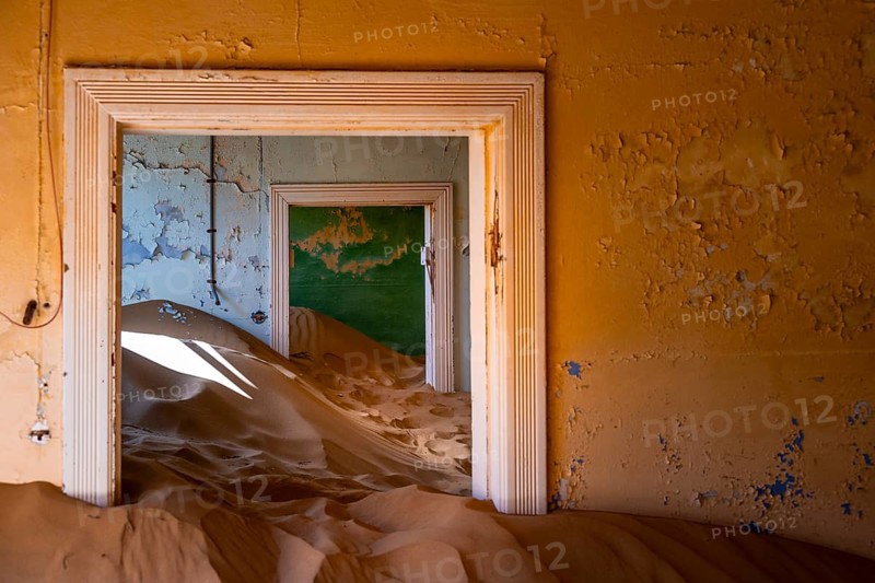 Interior view, doors and house full of sand, former diamond mining town, Namib Desert, Kolmanskop, Karas, Namibia