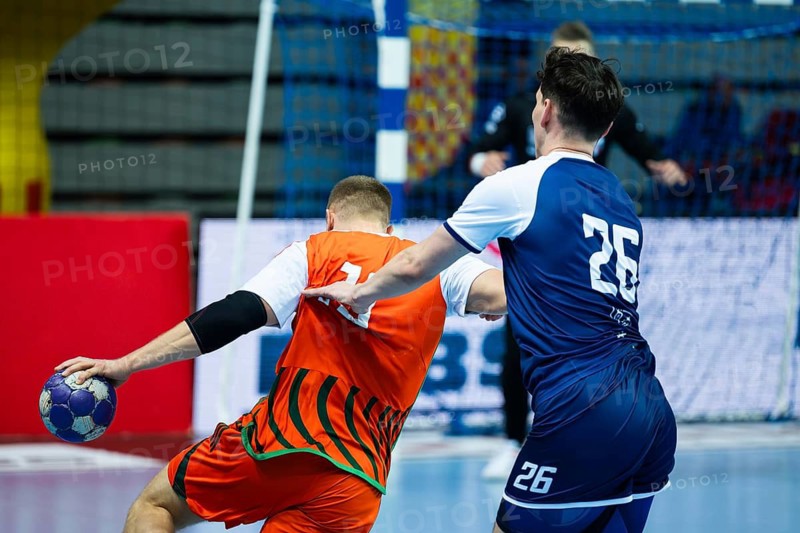 Backs of two handball players struggle during the match in Lubin, Poland