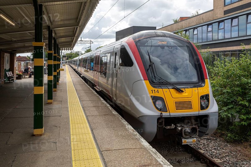 Greater Anglia Class 720 Aventra electric multiple unit locomotive train arriving at platform, Colchester Town railway station, Essex, England, UK