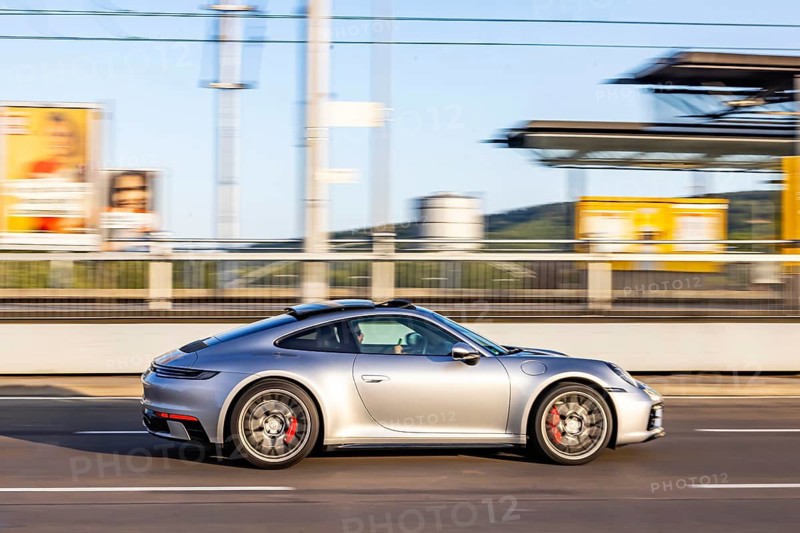 Car on the road in the city center. Porsche 911. Mitzieher.Stuttgart, Baden-Württemberg, Germany