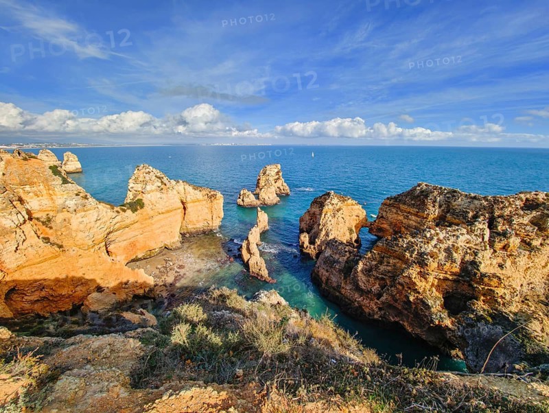 Ponte da Piedade in Lagos, Algarve, Portugal, reveals steep ocean cliffs, surf lines and freestanding sea stacks