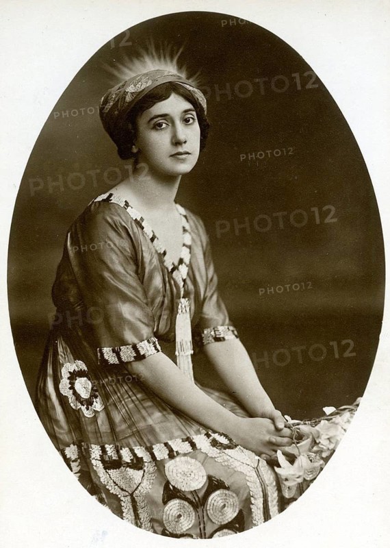 Tamara Platonowna Karsavina, dance, dancer, ballerina, ballet, St. Petersburg, Russia, Ballets Russes, Petrushka, The Firebird, Fokine, Diaghilev, A woman sitting and wearing a detailed dress and headdress, in a nostalgic style, around 1918