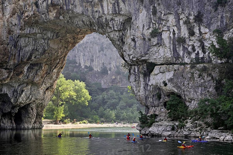 Canoes on the Ardèche river, above the Pont d'Arc rock gate, Ardèche Gorge, Gorges de l'Ardèche, Vallon-Pont-d'Arc, Rhône-Alpes, France