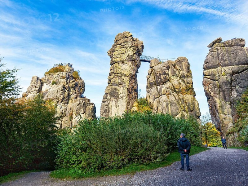 Cultural monument, Externsteine nature reserve, hikers in autumn, Horn-Bad Meinberg, Teutoburg Forest, North Rhine-Westphalia, Germany