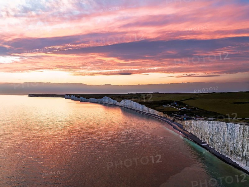 Sunset over Seven Sisters Cliffs from a drone, English Channel, East Sussex, South-east England