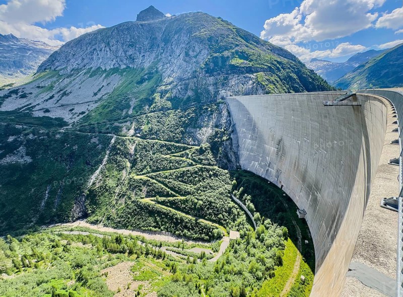 View of 200 meter high Kölnbrein dam facing away from the water with Airwalk viewing platform in the background, Malta Valley, Carinthia, Austria