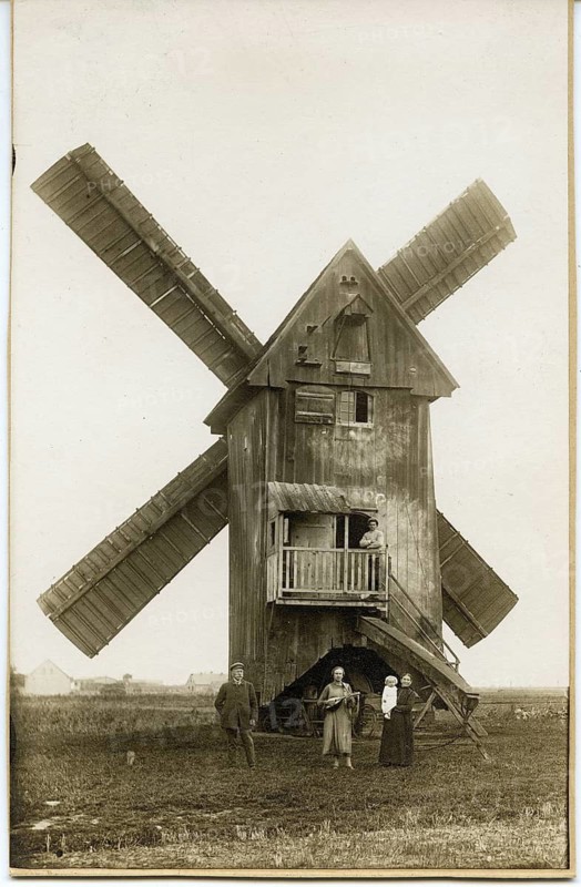 Wandervogel, Lebensreform, woman with lute, 19th century windmill, large wooden windmill with people in the foreground, rural environment and historic atmosphere, around 1924