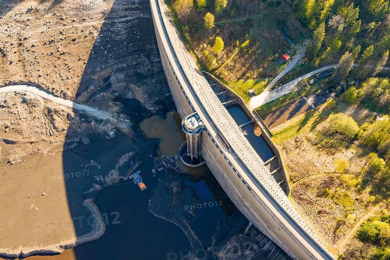 Aerial view of a dam with water area and adjacent forest, emptied Schwarzenbach dam, Forbach, Black Forest, Germany