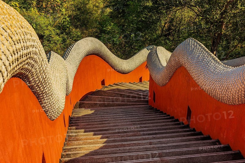 A staircase leads down from the Buddhist temple Wat Phra That Don Phra Chan, near Lampang, Lampang Province, Thailand