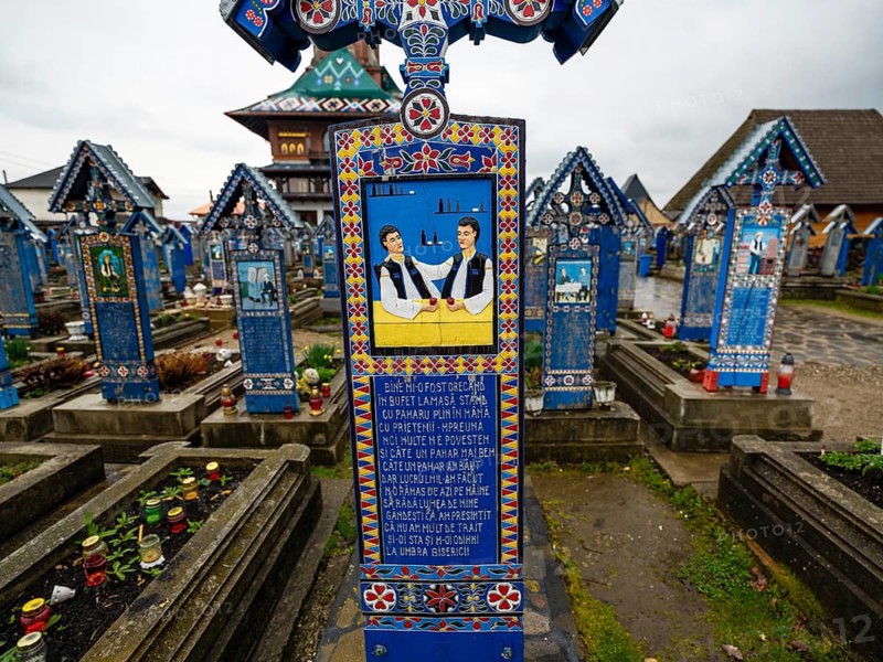 Colourfully painted wooden cross in the cheerful Cimitirul Vesel cemetery, Sapân?a, Maramure?, Romania