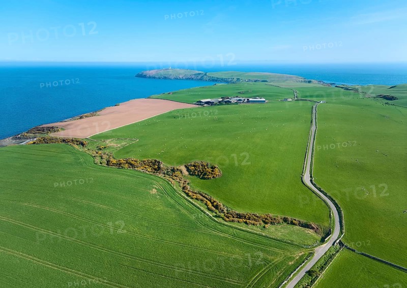 Aerial photo of a bay with golden sand beach at the scottish atlantic coast near Coldbackie, Scotland, UK