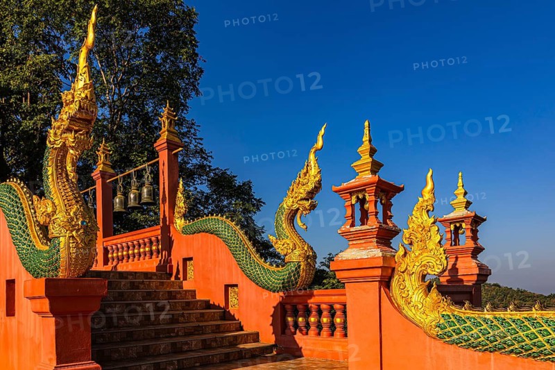 Gilded dragon figures on the stairway to the Buddhist temple Wat Phra That Don Phra Chan, near Lampang, Lampang province, Thailand