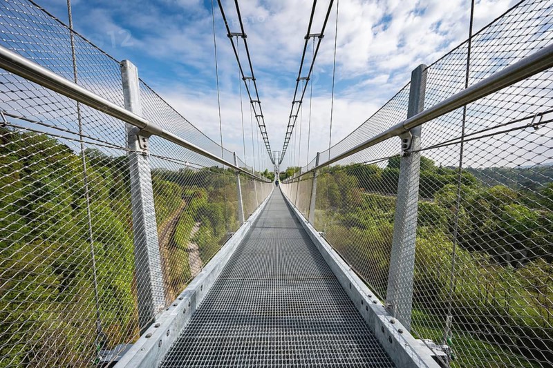 The Neckarline, a pedestrian suspension bridge up to 60 meters high with a wingspan of 606 meters above the Neckar Valley. The tourist attraction, built from a total of 444 tons of steel, serves to connect the historic old town and Bernese Field, where the 246 meter high TK Elevator test tower with the highest viewing platform in Germany is located. The Neckarline is the longest suspension bridge in southern Germany, Rottweil, Rottweil district, Baden-Württemberg, Germany