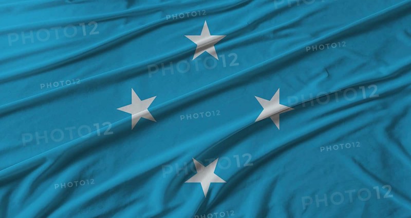 Micronesia flag waving. Flag of Micronesia with cloth texture
