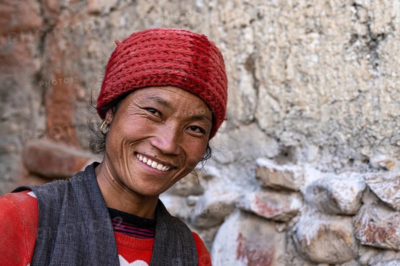 Portrait, young friendly woman in traditional dress, Tangge, Mustang, Upper Mustang, former kingdom, Himalayas, Nepal