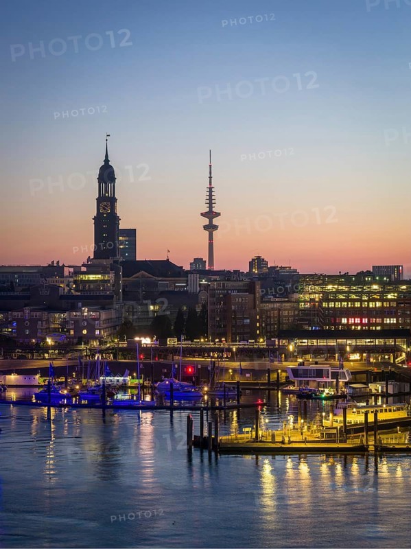 Aerial view of Landungsbrücken at sunrise on the Elbe with St Michael's Church (Michel) and Heinrich Herz Tower, Hamburg, Germany