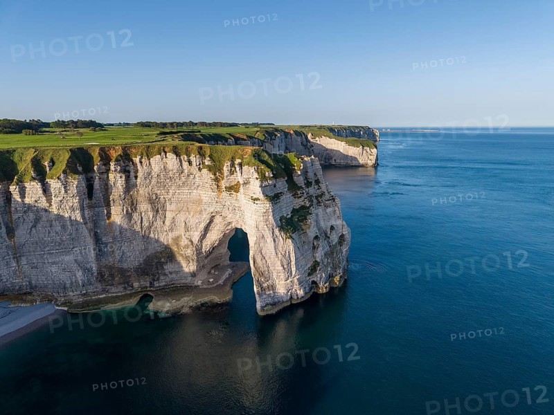 Aerial view of La Manneporte rock gate, behind it the distinctive Pointe de la Courtine promontory, Étretat, Alabaster Coast, La Côte d'Albâtre, chalk cliffs, English Channel, Seine-Maritime, Normandy, France