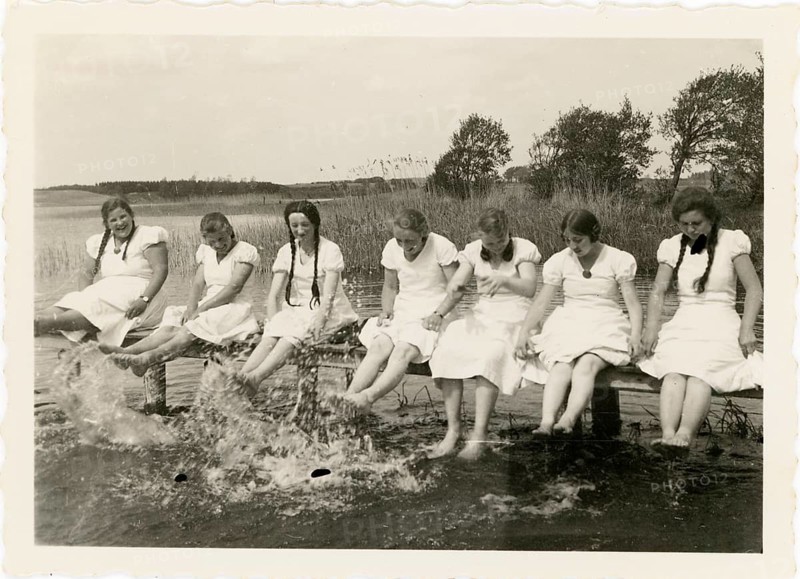 Bathing, swimwear, leisure, summer, woman, girls, woman sitting on a wooden walkway by the water and splashing with their feet lake, around 1928