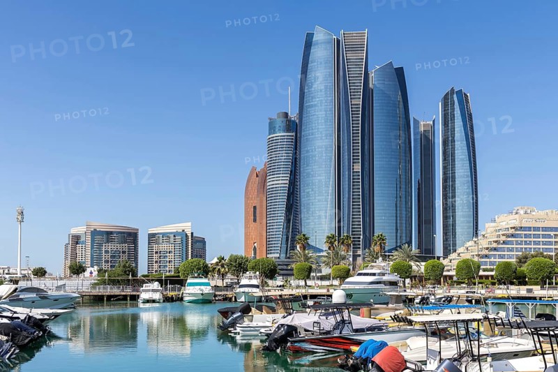 Abu Dhabi Skyline Etihad Towers skyscrapers with marina yacht harbor in Abu Dhabi, United Arab Emirates